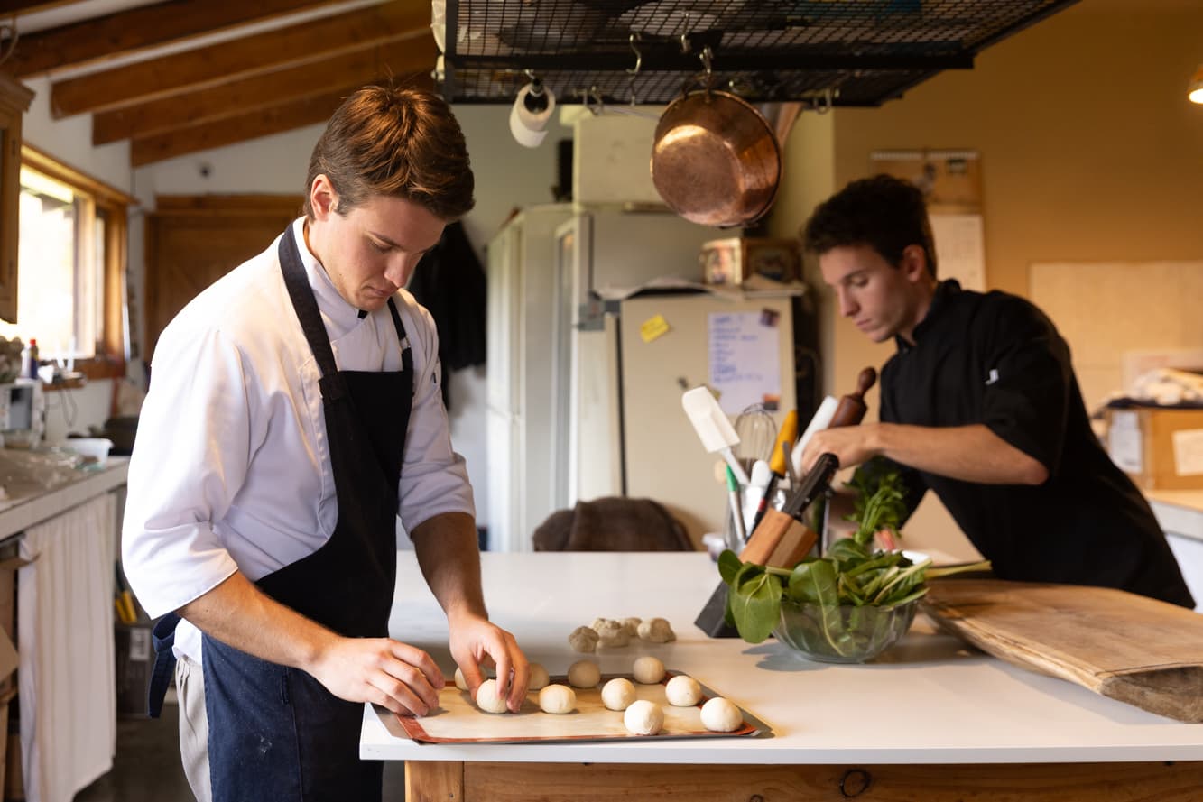La Pilarica Lodge kitchen team preparing dishes with fresh local ingredients